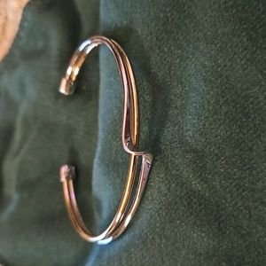 Lia Sophia two tone gold and silver tone bangle bracelet